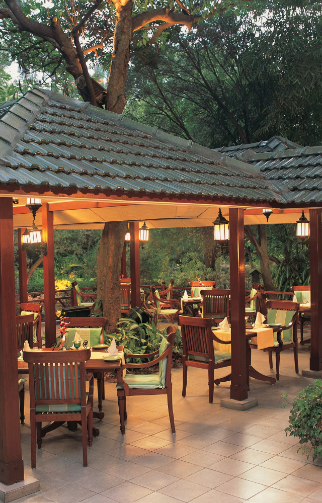 Offers a stunning ambiance with a view of the cityscape and serene outdoor seating. Perfect for a luxurious dining experience