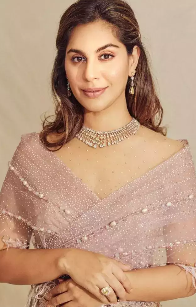 Wife of Ram Charan, co-founder of Apollo Hospitals.