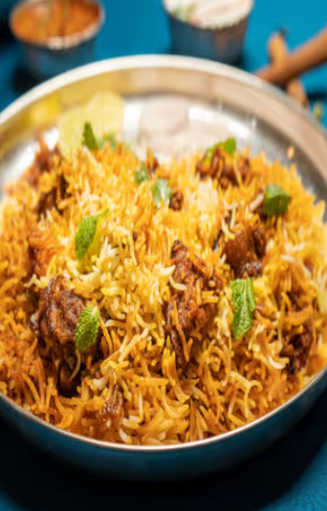 A fragrant rice dish cooked with spices, meat (usually chicken or mutton), and sometimes vegetables.