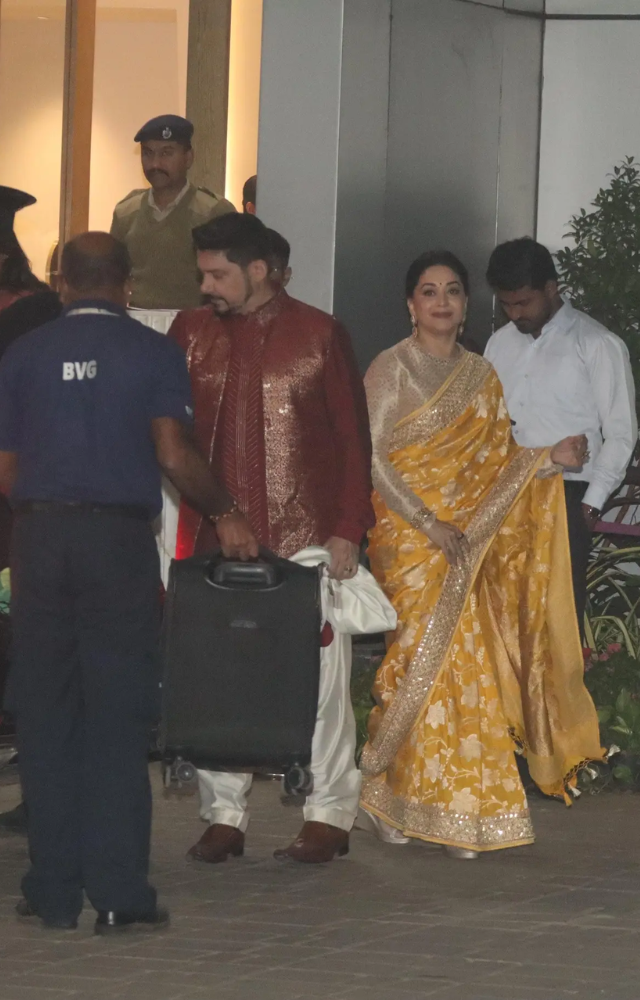 Madhuri Dixit opted for a gorgeous yellow saree for the occasion while Dr Nene looked sharp in a bright red kurta