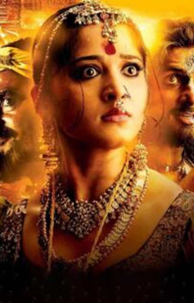 Played by Anushka Shetty, she is a strong-willed princess who fights against supernatural forces and upholds justice.

