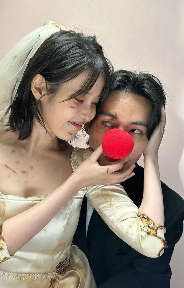 In the music video, IU and V are seen playing lovers, and they shoot some cute photos together in a photo booth.