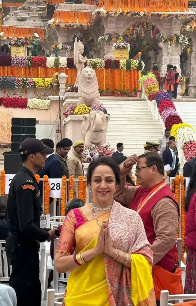 She was seen wearing a beautiful yellow saree paired with a contrasting pink blouse. The actress posed with folded hands as she stood in front of  Ram Mandir