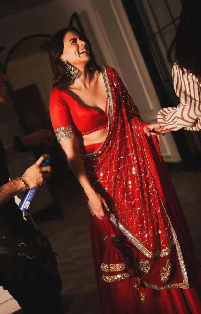 Alia Bhatt looks stunning in a custom made red colour block lehanga and sparkle dupatta