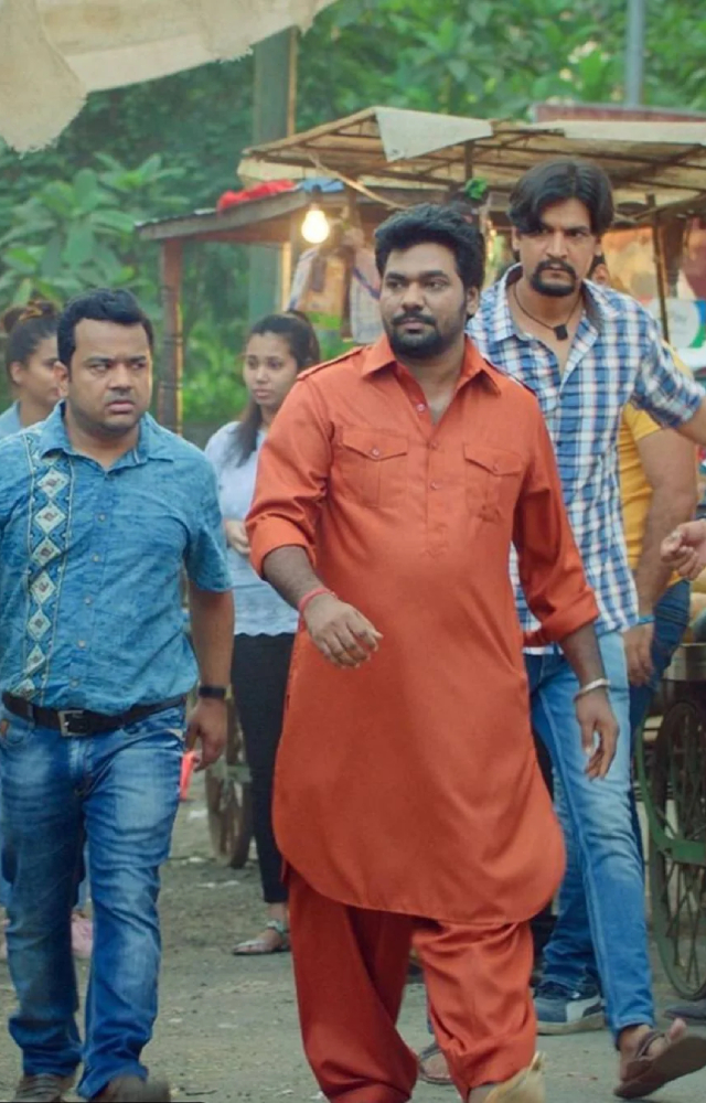 What happens when an ambitionless young man, who shares the same surname as an influential politician, tells everyone that he`s connected to the MLA?