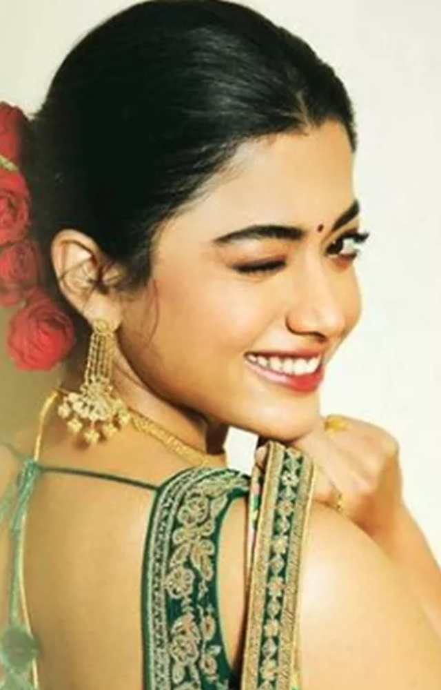 Rashmika`s iconic wink in her movies has become a trademark move, melting hearts and sparking trends on social media.