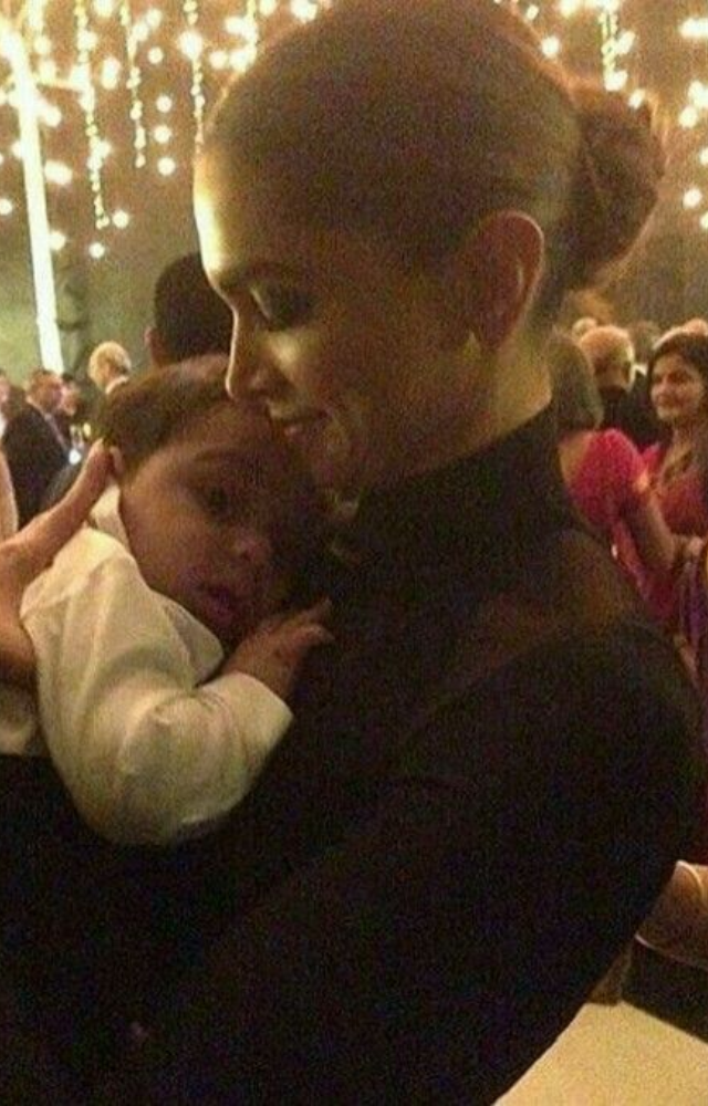 She often interacts warmly with babies during public events, showcasing her natural comfort and fondness.