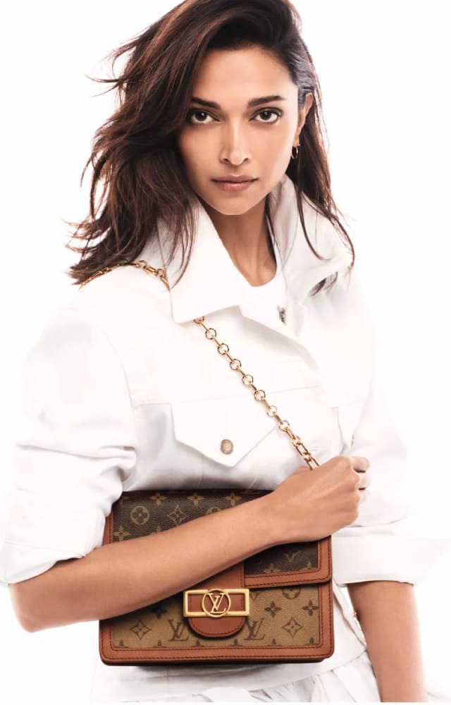 Louis Vuitton and its statement bag are every celebrity staple. Deepika Padukone looks like a vision in white as she poses with the LV bag.