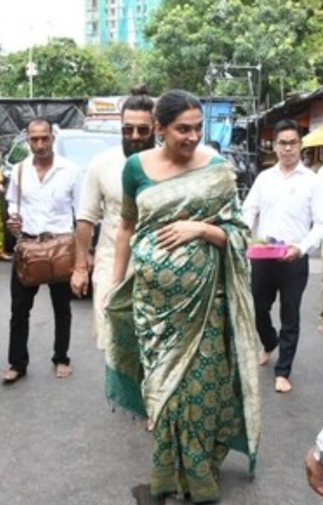 Deepika dazzled in a beautiful green Benarasi saree, while Ranveer complemented her with an elegant off-white kurta set.