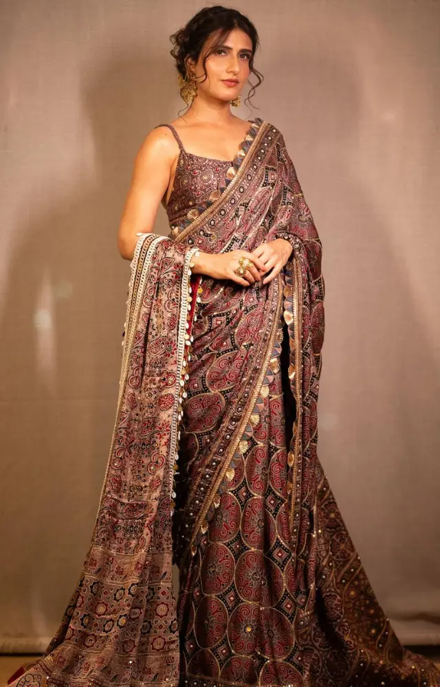 Fatima Sana Shaikh dazzles in a heavily embroidered saree that showcases intricate patterns and rich textures, perfectly highlighting her graceful appearance