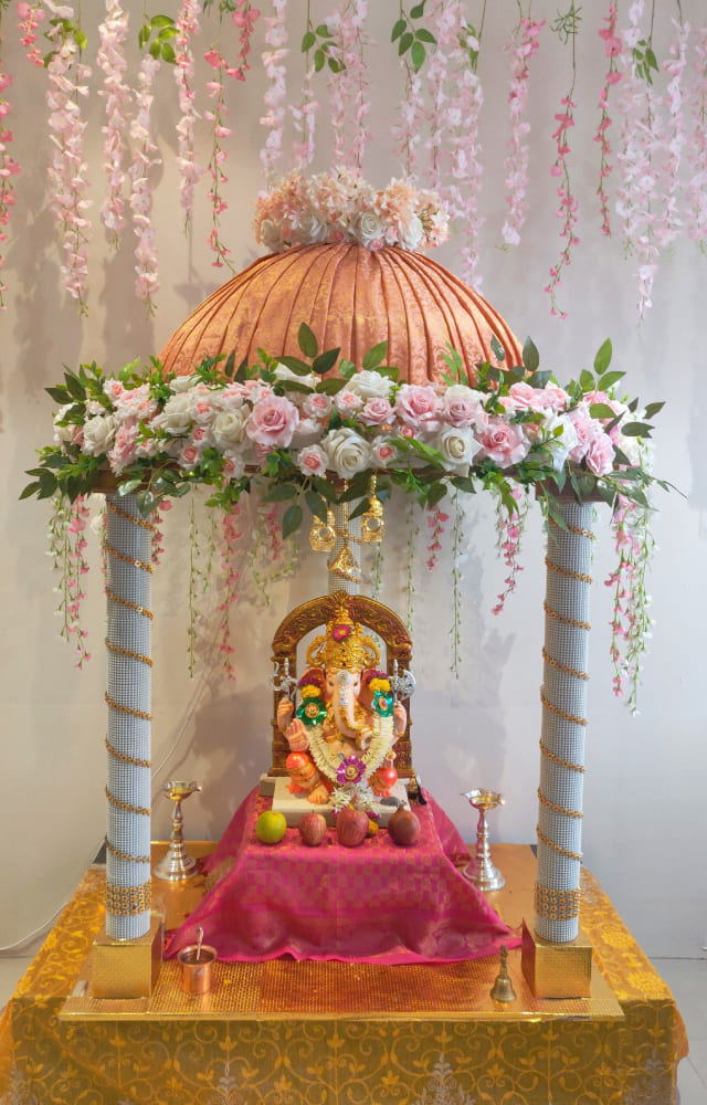Flowers and floral decoration can never run out of style. Opt for artificial flowers for a simple Ganpati decor. Real flowers can be an aesthetic game-changer.