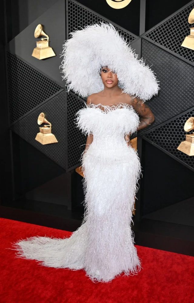 Summer Walker stood out in this white feather dress with a matching headgear