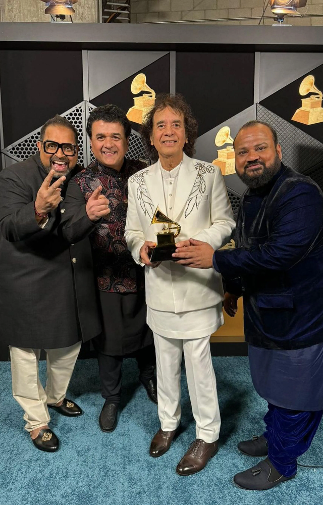 Ustad Zakir Hussain, vocalist Shankar Mahadevan, percussionist V Selvaganesh and violinist Ganesh Rajagopalan of Shakti pose for photos with the award.