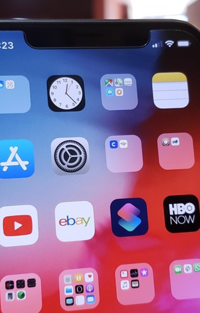 To achieve a minimalistic home screen, you can remove text labels from your apps, slightly increasing the size of the app icons.