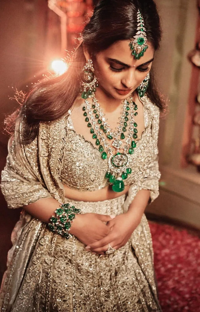She stole the limelight at Anant Ambani and Radhika Merchant`s pre-wedding celebrations, where her golden lehenga paired with royal emeralds went viral.