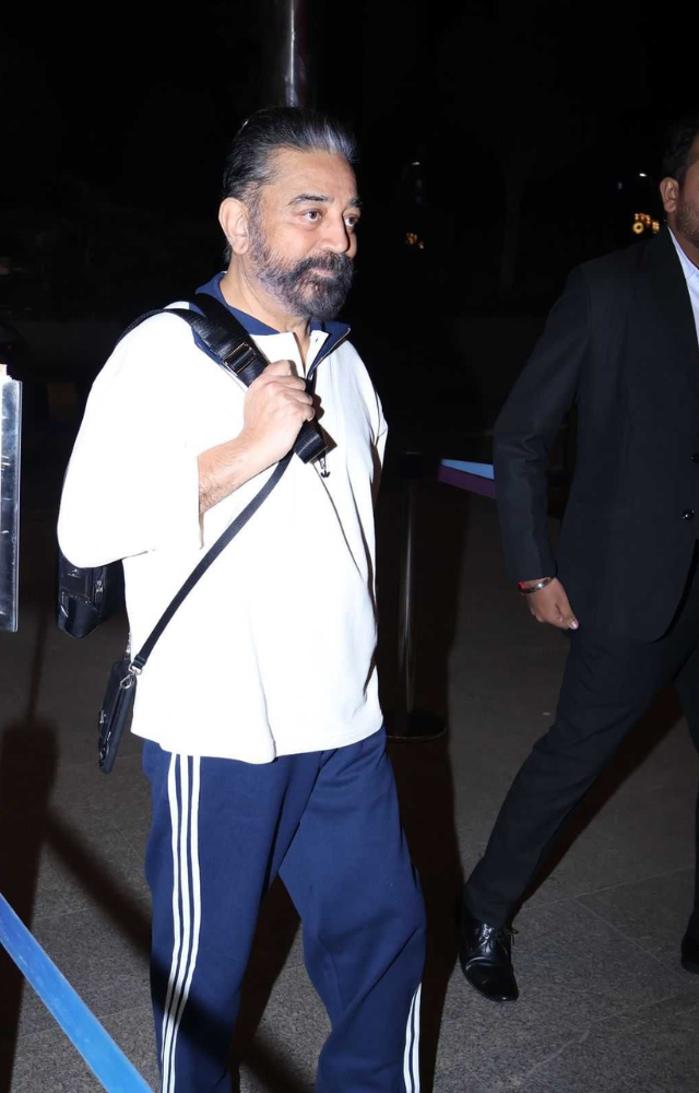 He frequently wears crisp white shirts paired with comfortable trousers or jeans, showcasing a timeless and relaxed style.