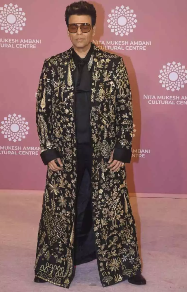 Karan Johar wore this unique floor-length gold-embroidered coat designed by Rahul Mishra at the Nita Mukesh Ambani Cultural Centre`s opening night.