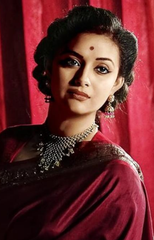 Keerthy portrays Savitri, a legendary South Indian actress, showcasing her struggles and triumphs in a male-dominated industry.