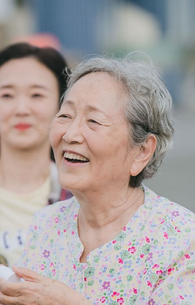 Plays Kim Gam-ri, a loving and feisty elder known for her warmth and traditional values.