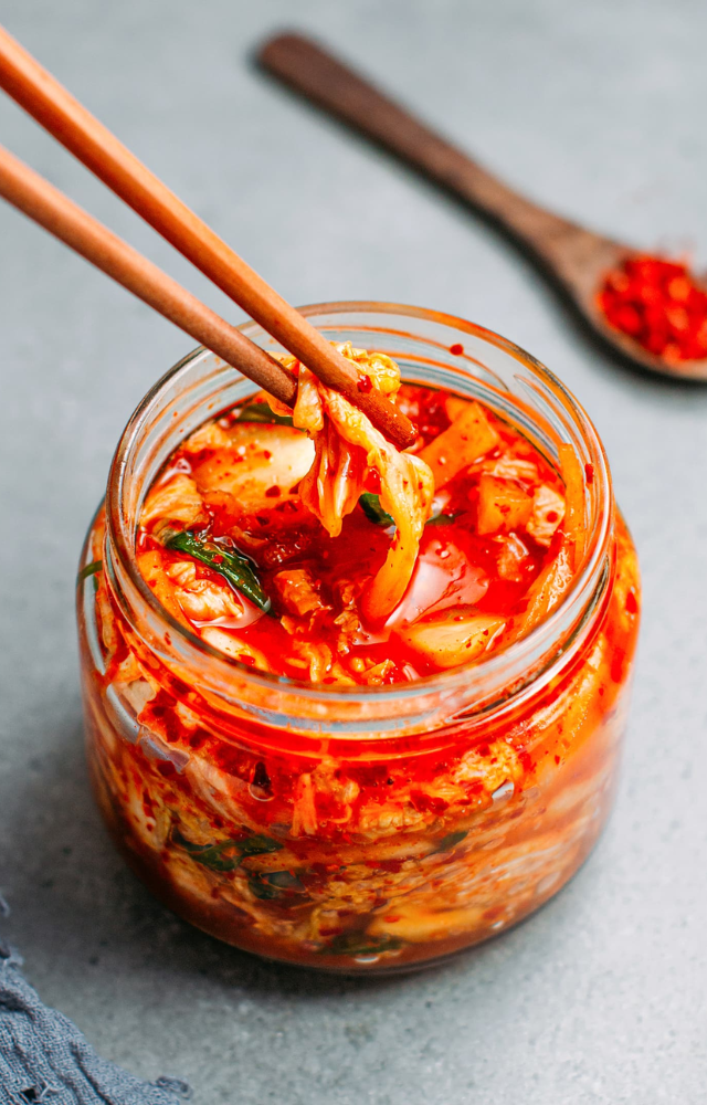 Fermented foods like kimchi are probiotic-rich. Adding yoghurt, pickles, and drinks helps improve gut health for Indians.