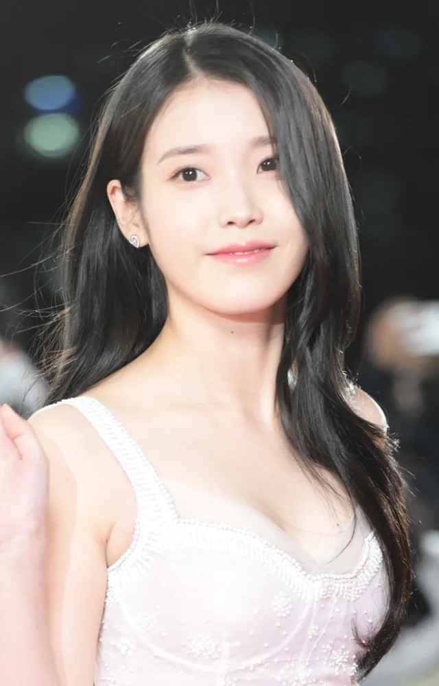 IU grew up facing extreme hardships, even living in a cockroach-infested room with her grandmother. Her talent and perseverance brought her success.