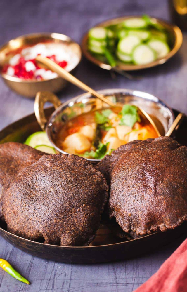 Gluten-free puris made with buckwheat flour, usually served with curd or aloo sabzi.