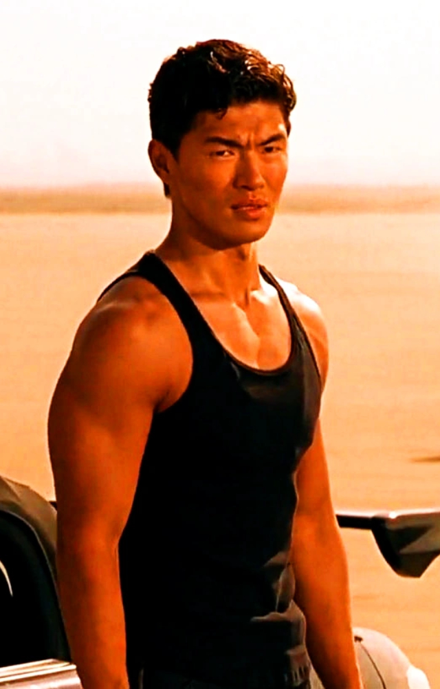 Let`s put you out of your misery. The villain in L2 Empuraan is Korean-American star Rick Yune. He plays the role of Shen Triad.