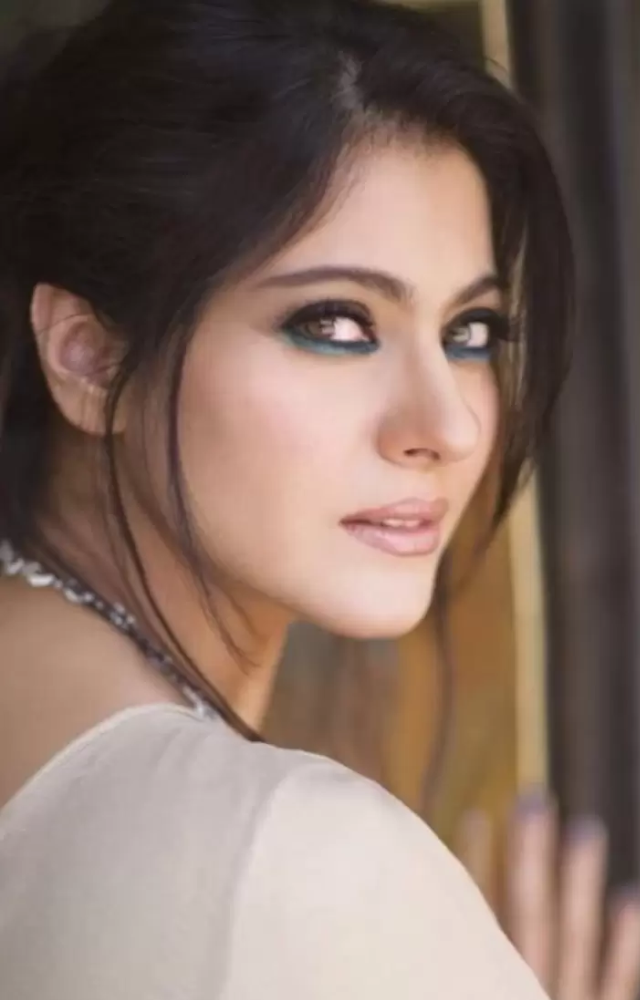 Kajol`s makeup style in movies like 'Kabhi Khushi Kabhie Gham' featured bold eyeliner and red lipstick, giving her a striking appearance.