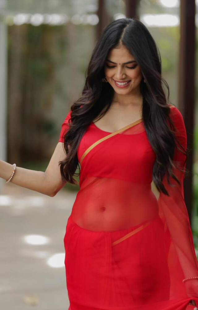 The saree’s traditional design and styling pay homage to classic Indian fashion, showcasing her cultural heritage.