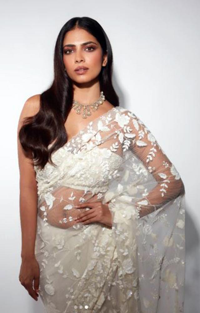 Malavika Mohanan sizzling in white saree