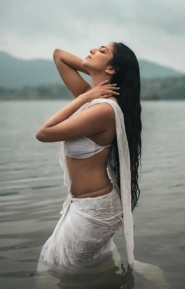 In the picture, the Master actress is seen striking sensual poses in a white chiffon saree