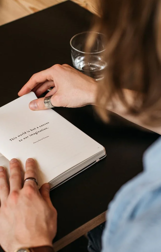 Writing down things they are grateful for to cultivate a positive mindset and attract more abundance.