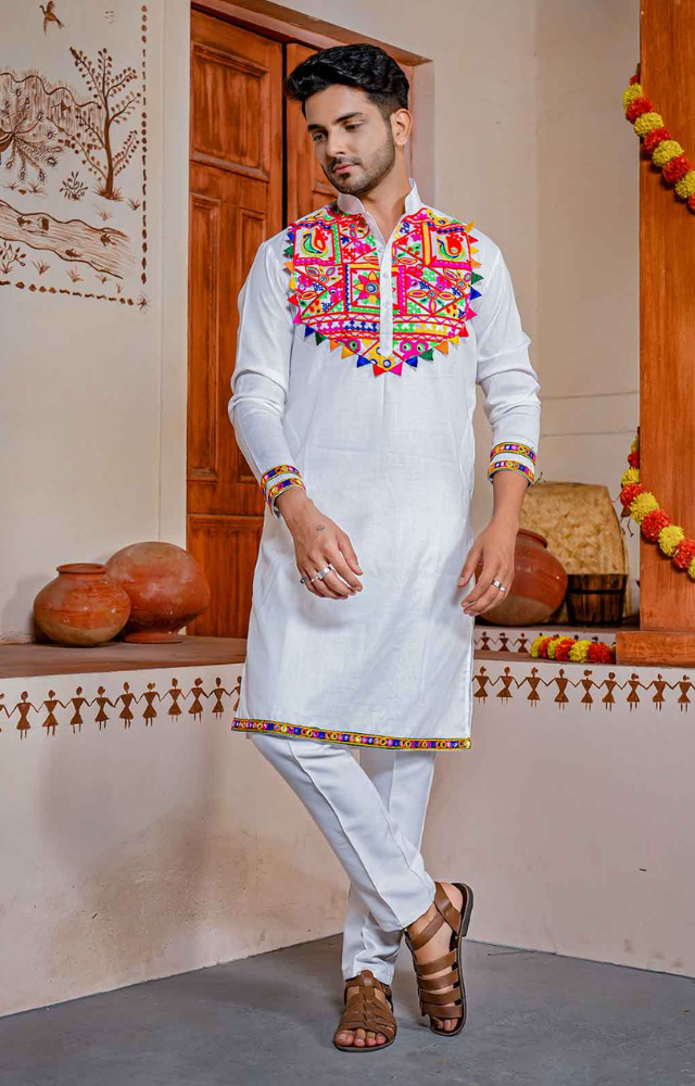 Men typically wear kurta-pajama sets in vibrant colors with embroidery or mirror work for Garba, sometimes adding a dhoti for authenticity.
