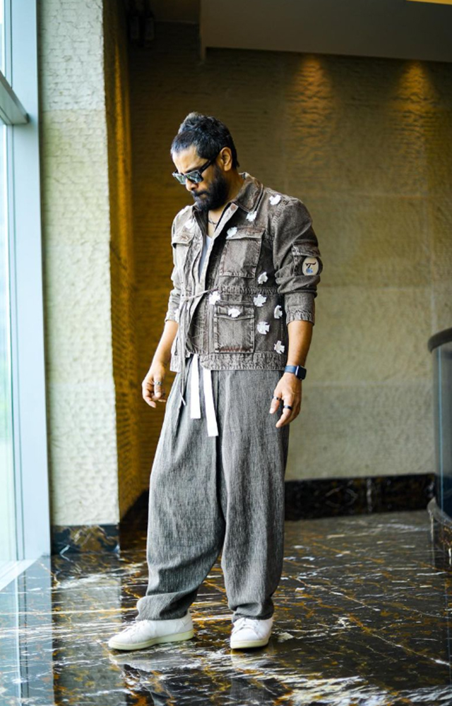 Chiyaan Vikram stands out as a fashion-forward icon, donning a unique outfit and showcasing his inimitable style.