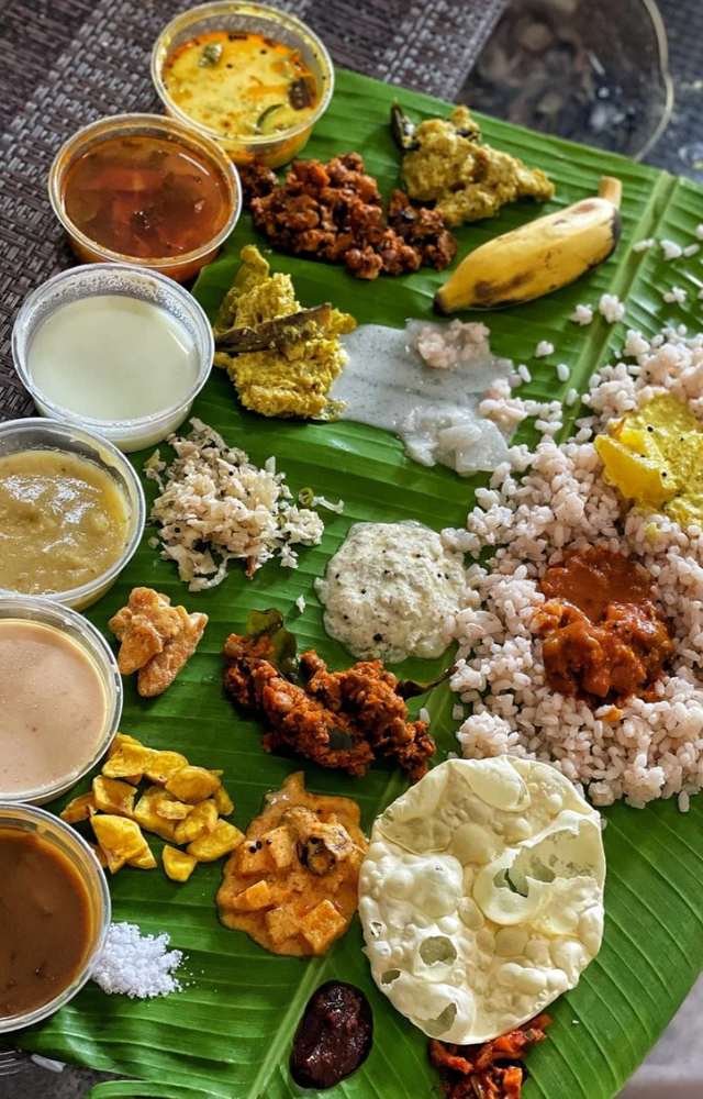 The Onam feast, or Onasadya, is a grand vegetarian meal served on banana leaves, featuring a variety of dishes like sambar, avial, and payasam.