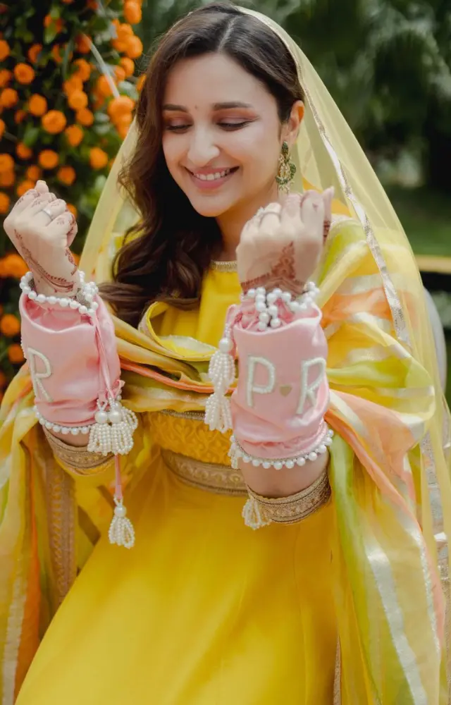 Parineeti Chopra looked absolutely resplended in her yellow attire which was perfectly complemented by the pink bangles