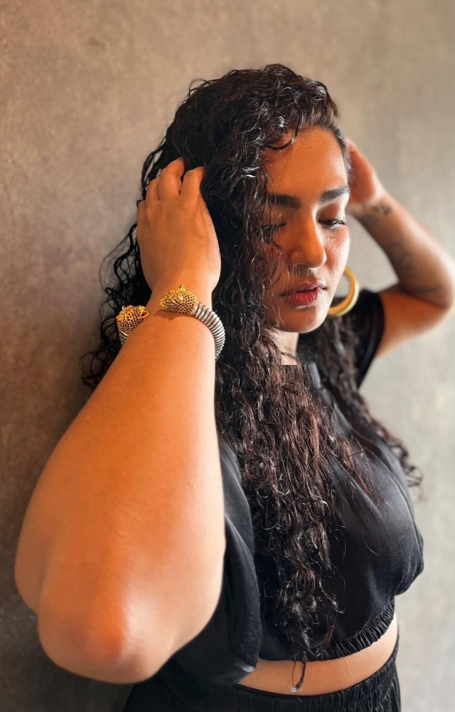 Parvathy isn`t afraid to experiment with unconventional silhouettes and cuts. Her wardrobe often includes asymmetrical designs