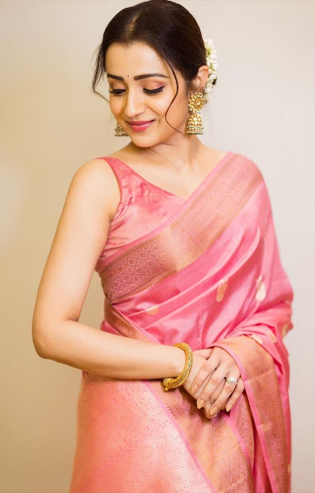 Trisha is flaunting in this auspicious festival season with her pink color saree. Pongal has been graciously blessed with her looks says her fans.