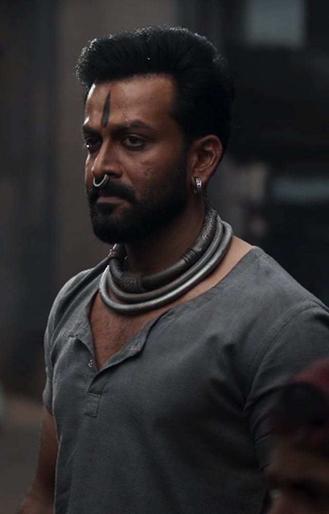 Actor Prithviraj will play the role of Vardharaja Mannaar in the movie Salaar. He look stunning in his rugged appearance and Fans are excited to see his role!