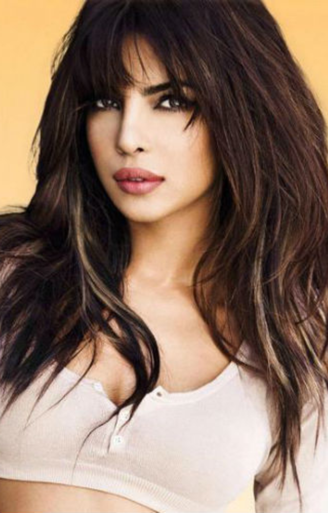Priyanka`s layered cut with eyebrow bangs looks pretty on girls with oval or round faces. Highlights with this haircut can make your hair look voluminous.