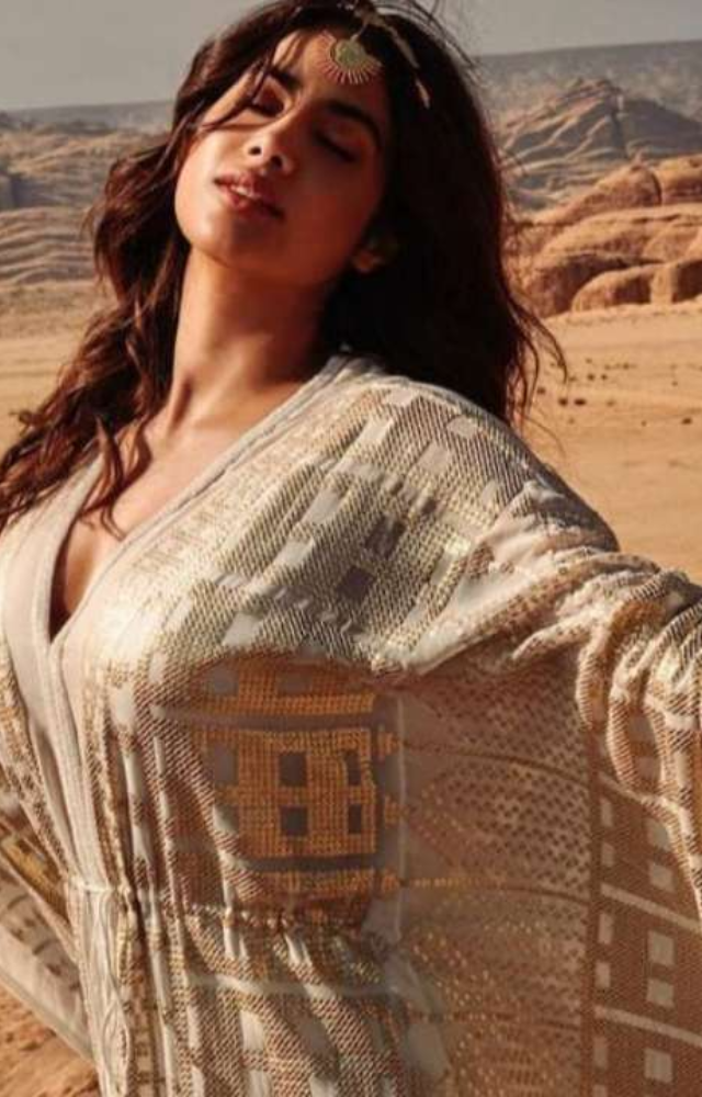 Flowing kaftans with intricate designs are a favorite. Example: Janhvi Kapoor in a white-golden kaftan by Manish Malhotra.