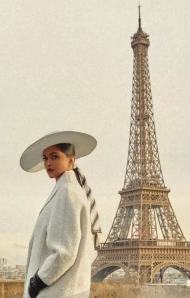 Deepika shared breathtaking photos from Paris, showcasing her glamour at the Louis Vuitton Fall/Winter 2025 show with a chic white winter coat, bodycon pant. 