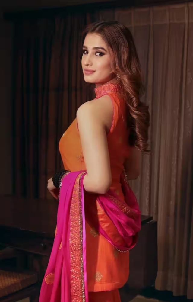 Ditch those heavy suits and go for something subtle yet chic. Take notes from Rasha Thadani`s vibrant orange sharara with contrasting pink dupatta.