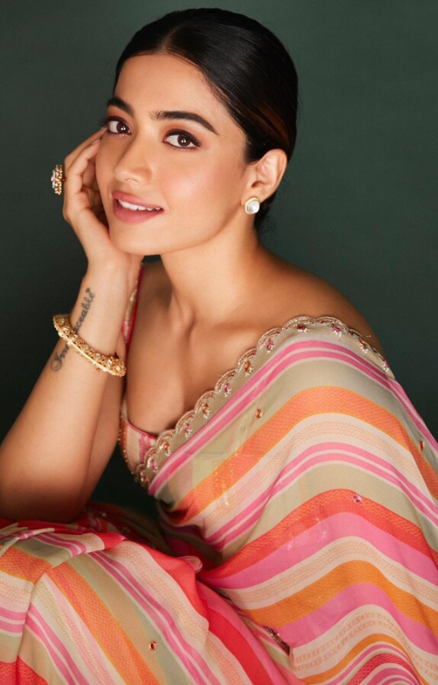 The saree`s vibrant colors complemented Rashmika`s complexion, adding a radiant glow to her overall look and enhancing her natural beauty.