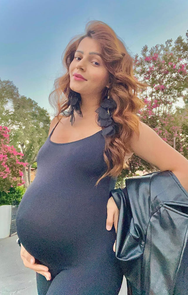 The popular television actress turns a year old today. She won several hearts during her stint in Bigg Boss 15. Let`s have a look at her pregnancy fashion.