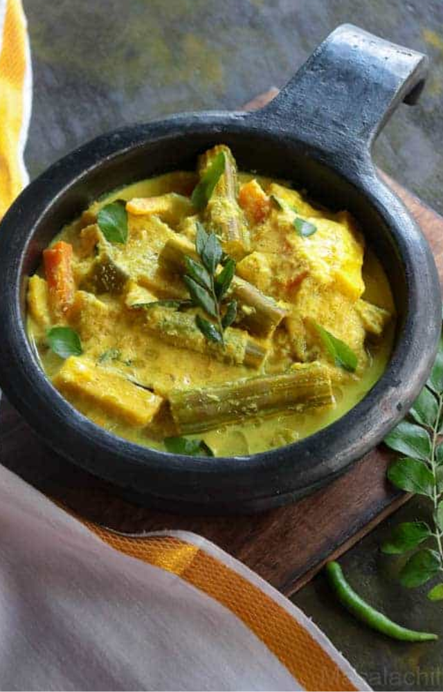 A mixed vegetable curry cooked with coconut, yogurt, and spices, offering a rich and flavorful side dish.