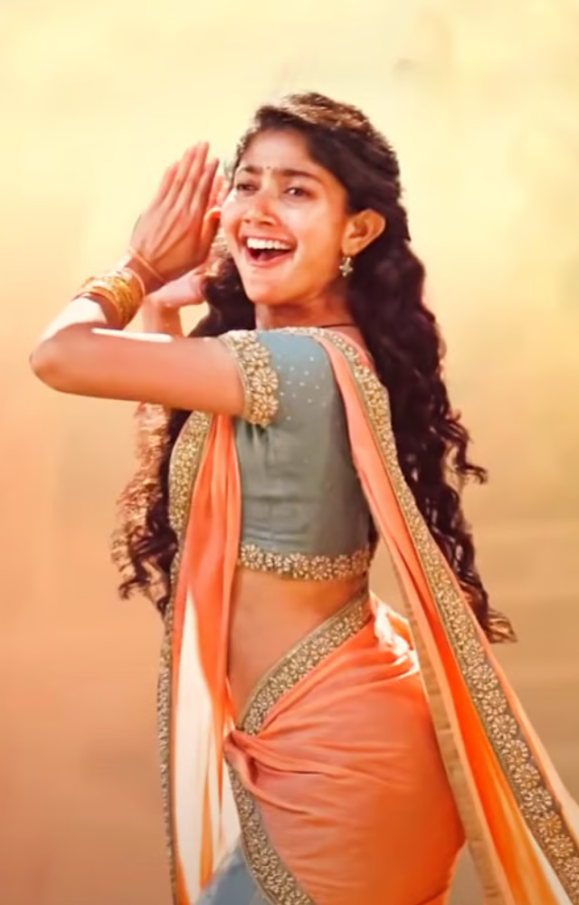 Her natural expressions and energetic performance in this folk-inspired number made it a massive hit.