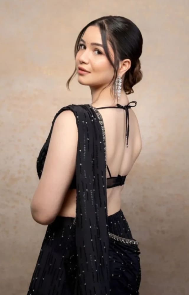 Sara Tendulkar looks dazzling in a custom onyx black embellished saree designed by Jade. She finished her look with statement earrings and a messy bun.