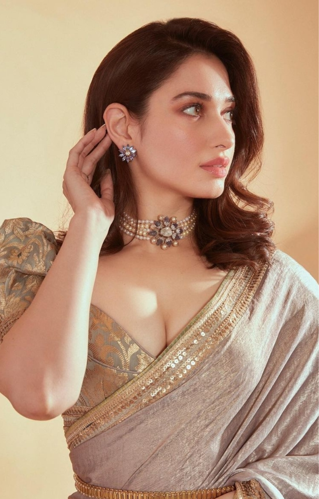 She effortlessly carries off various colors, from deep greens to vibrant purple, and lighter shades, making each saree look unique.