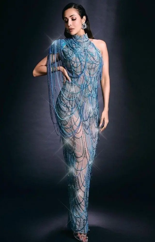 Malaika Arora wore a stunning blue naked gown with a one-side power shoulder. The asymmetric design of her gown added an edgy element to her look
